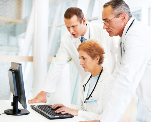 Doctors reviewing security risk assessment tool, sra